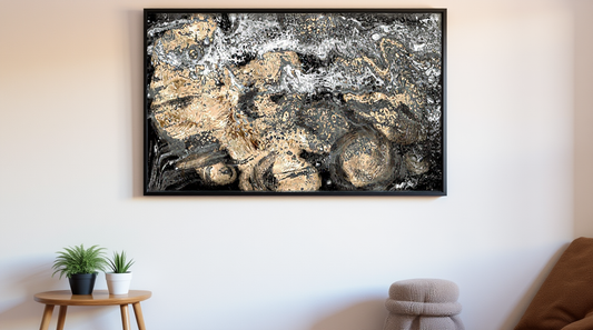 Abstract space black and gold painting in a modern living room setting